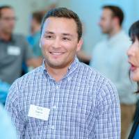 President Philomena Mantella talking to guests